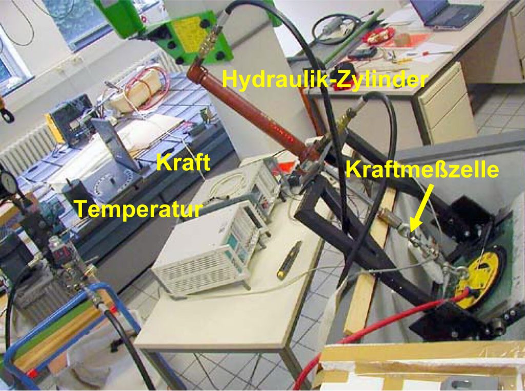 The photo shows the test set-up for a low-temperature measurement on suction cups.